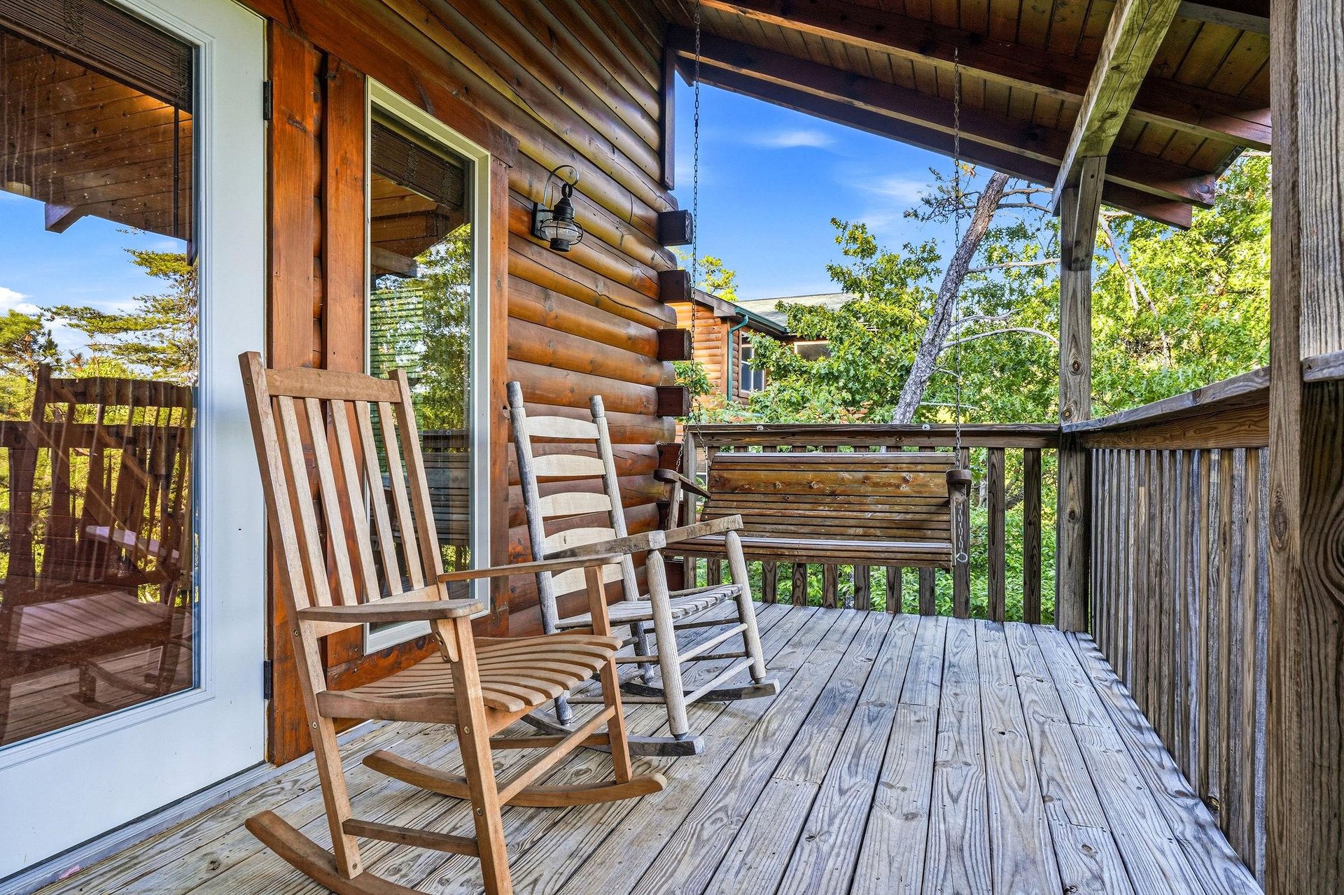 Imagine yourself swaying gently in one of these rocking chairs, sipping your morning coffee as you take in the mountain views and feel the fresh breeze through the trees around you.