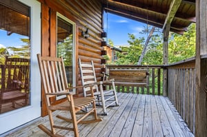 Imagine yourself swaying gently in one of these rocking chairs, sipping your morning coffee as you take in the mountain views and feel the fresh breeze through the trees around you.