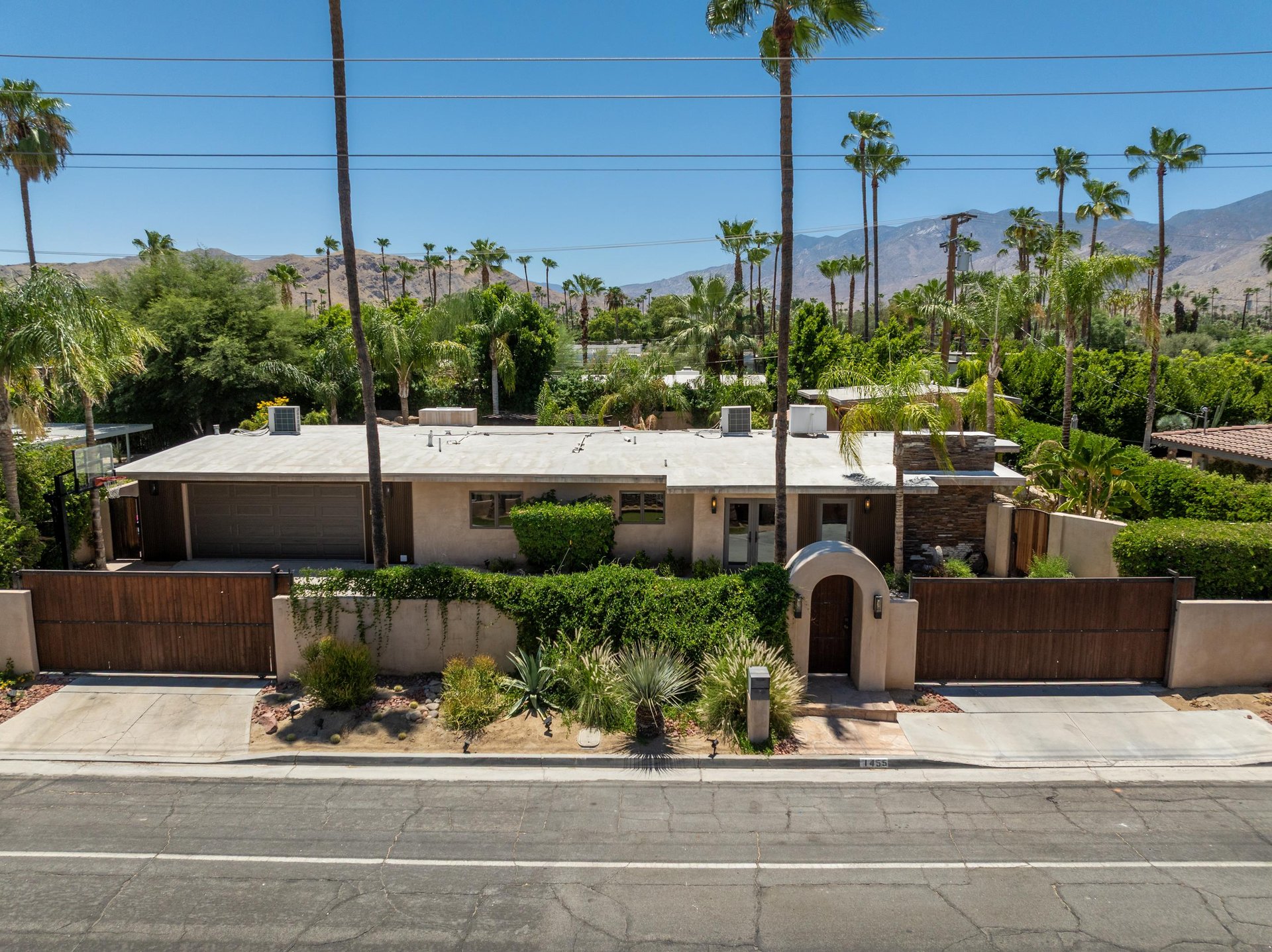 View of the home with gates for added security and privacy.