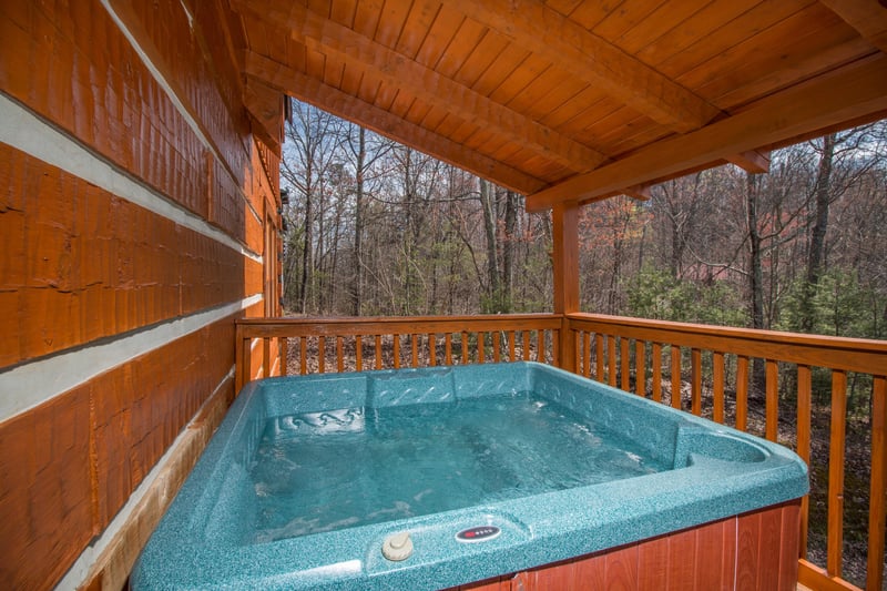 Hot tub on the main floor deck at EllaVation, a 3 bedroom cabin rental located in Gatlinburg