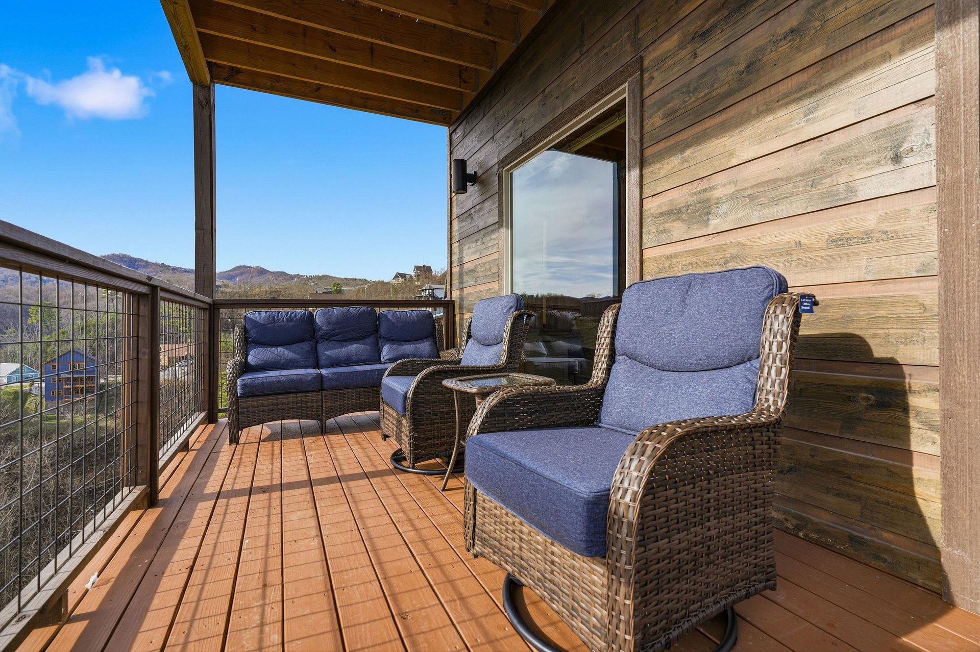 Unwind on your private covered deck with plush seating and stunning mountain views stretching to the horizon.