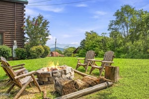 The property is nestled in a scenic mountain valley surrounded by lush greenery and natural beauty.