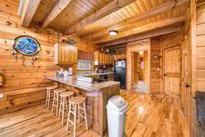 Kitchen with black appliances at Alpine Sondance, a 2 bedroom cabin rental located in Pigeon Forge
