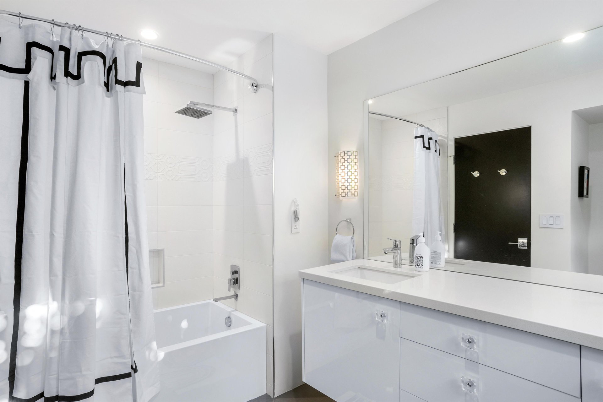 Ensuite bath featuring a bathtub