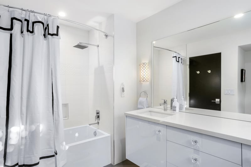 Ensuite bath featuring a bathtub