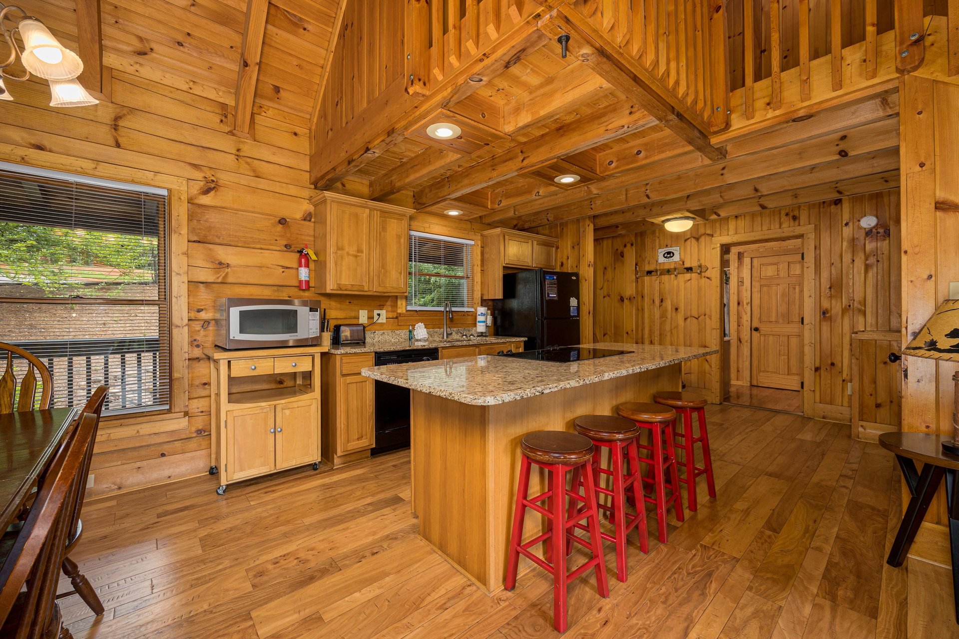 Kitchen with island and bar stools