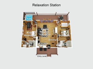 Overhead layout of your Relaxation Station retreat showing two king bedrooms with private baths, open living space with sofa bed, full kitchen and dining area, plus private hot tub and outdoor spaces.