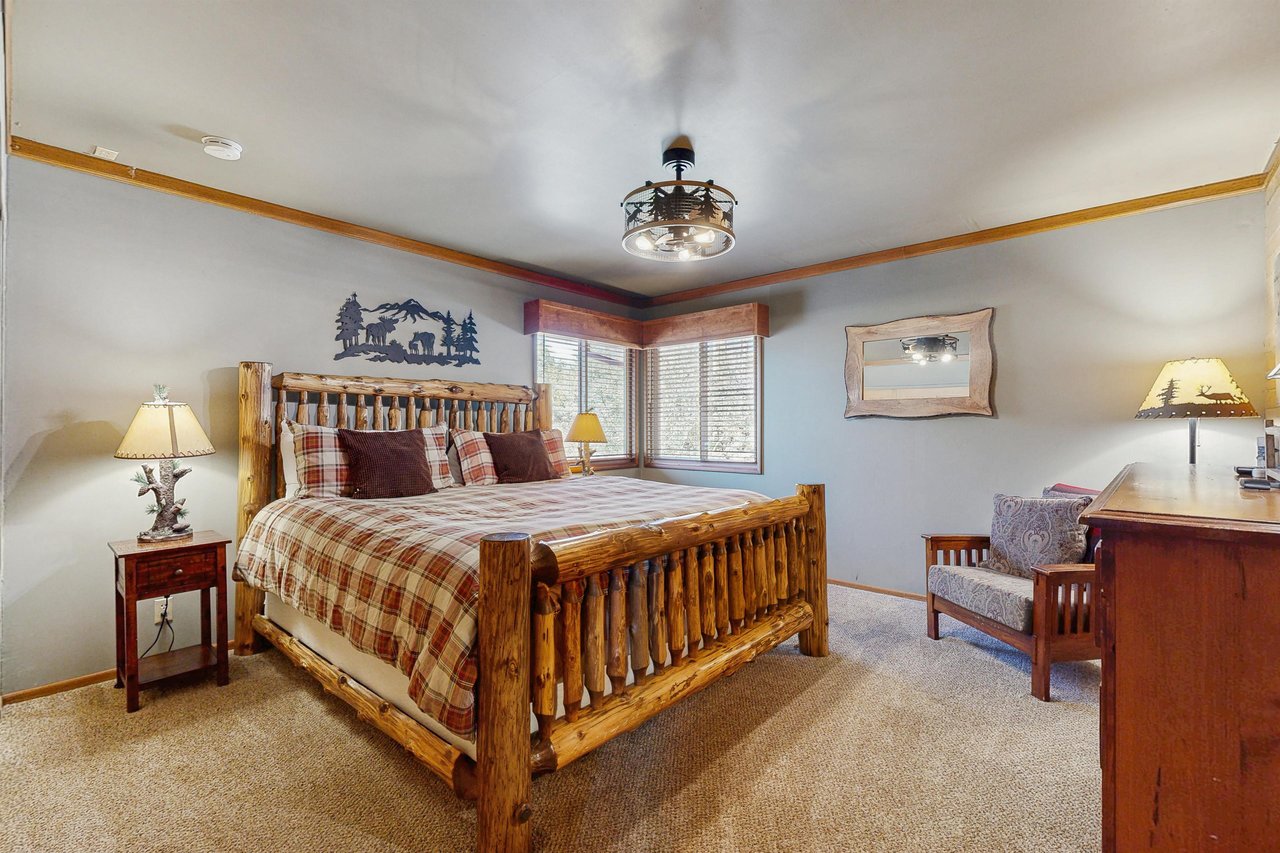 Primary bedroom with king bed and smart TV.