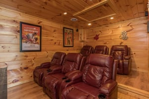 Large recliners in the theater room at Graceland, a 4bedroom cabin rental located in Pigeon Forge