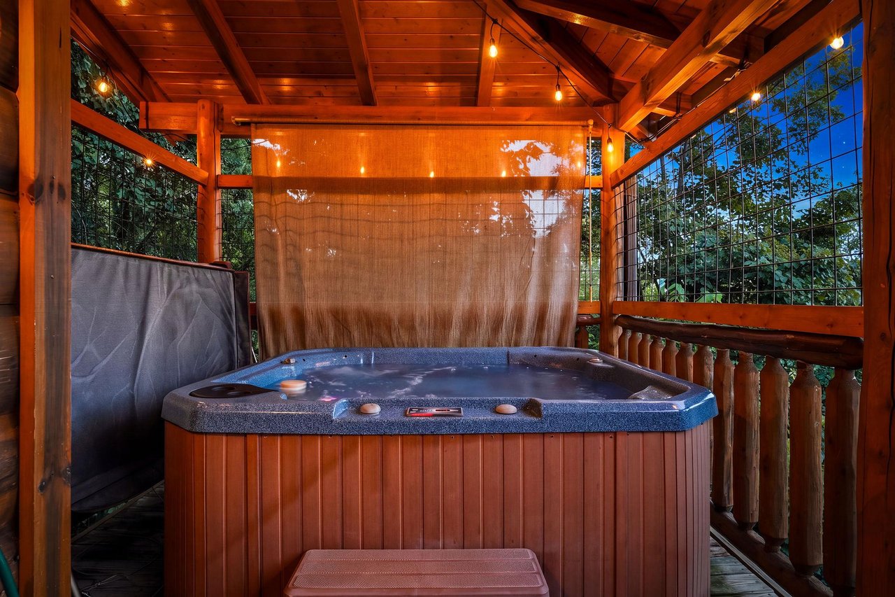Soak in your own private hot tub under the glow of warm wood beams, wrapped in the tranquility of lush forest views on all sides.