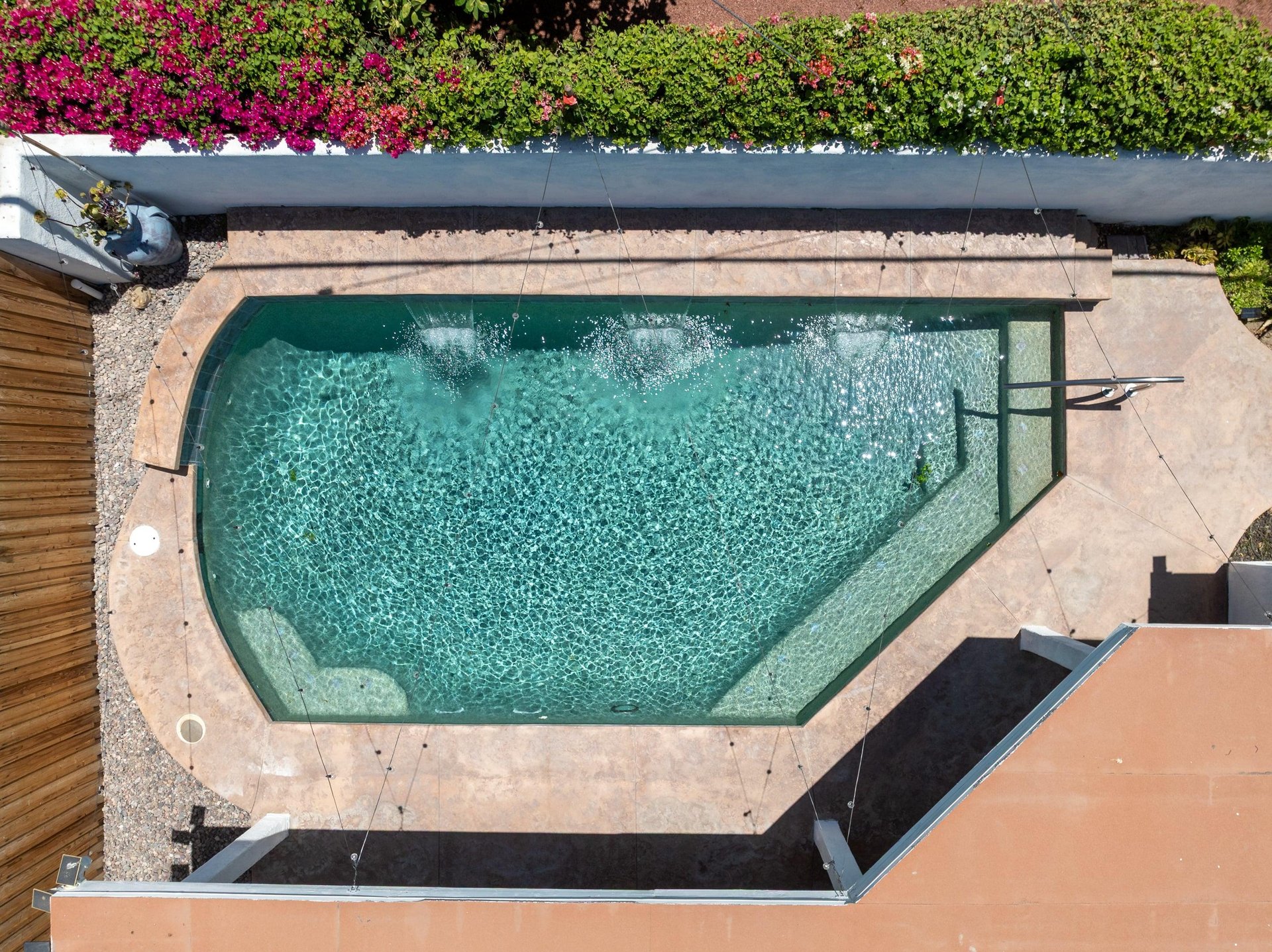 Private pool with fountains.