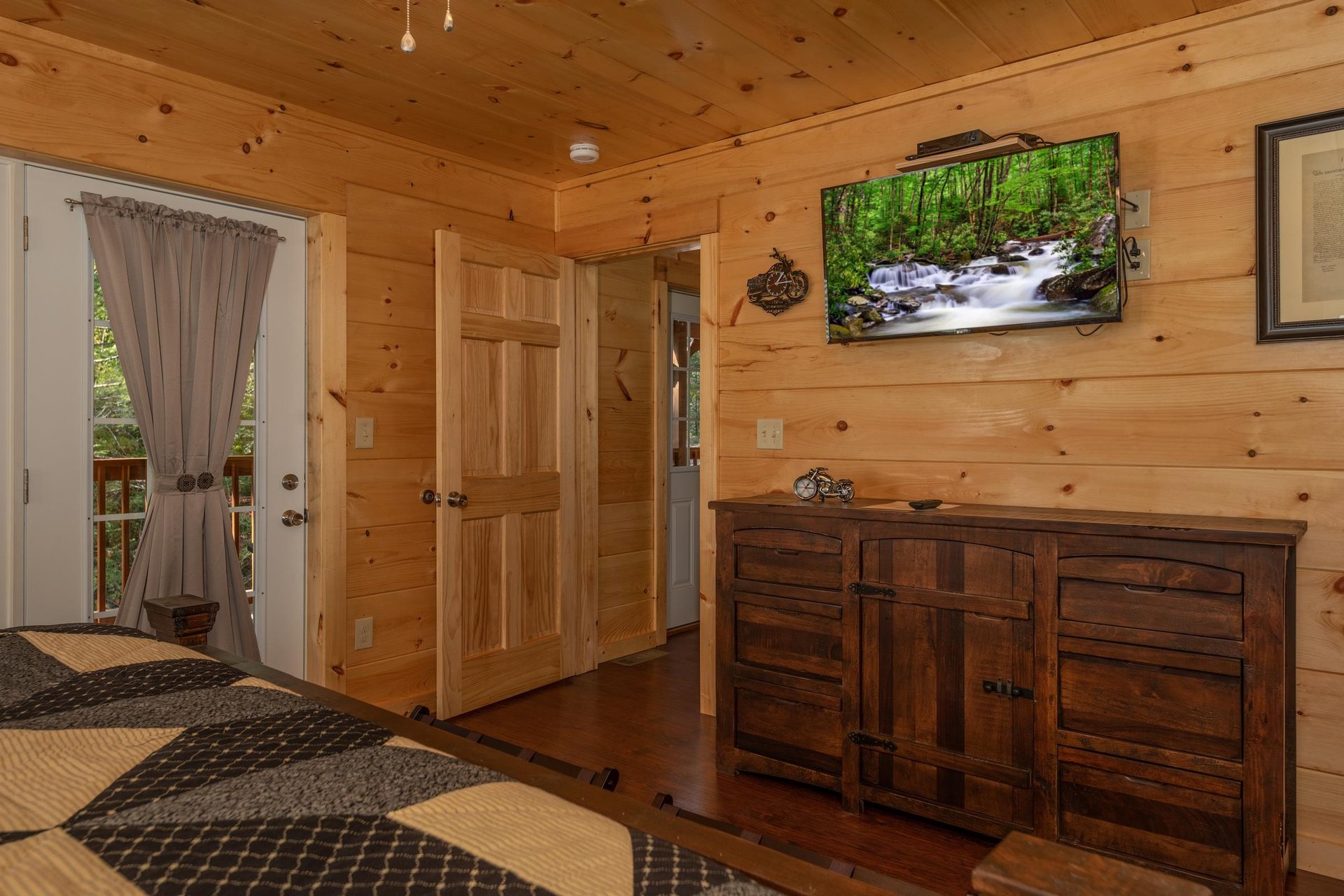 King bed facing dresser and tv