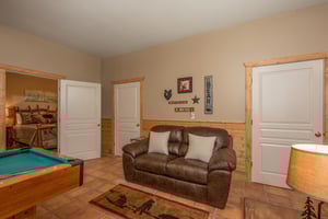 Love seat near pool table