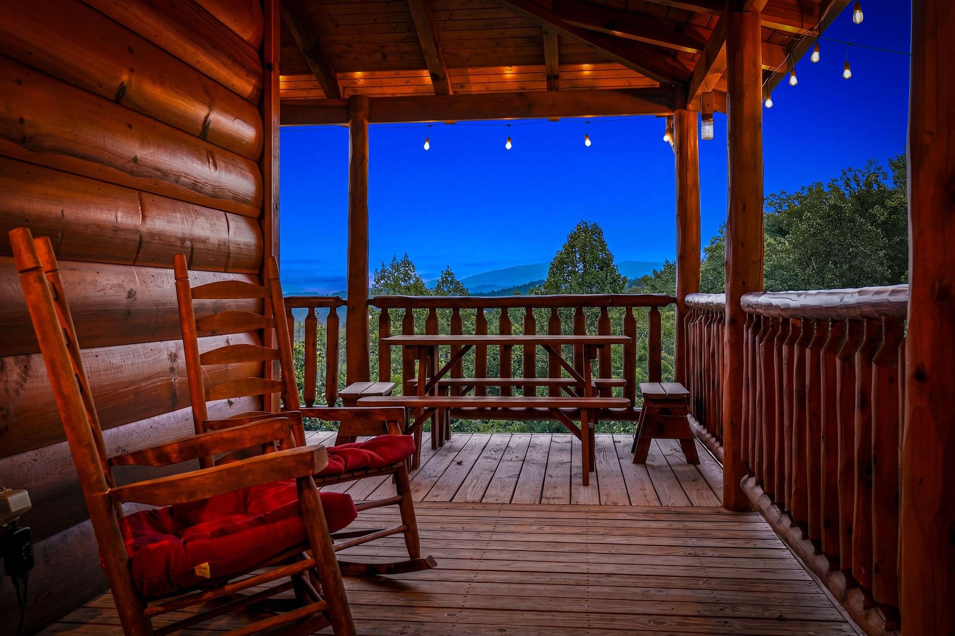 Unwind on your private porch as twilight descends. Rock gently in handcrafted chairs, breathe in the mountain air, and let the forest views soothe your soul.