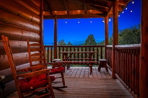 Unwind on your private porch as twilight descends. Rock gently in handcrafted chairs, breathe in the mountain air, and let the forest views soothe your soul.