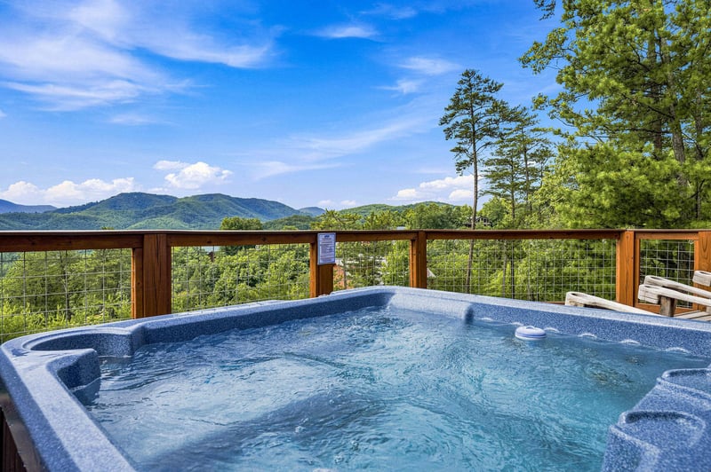 Soak in your private hot tub while taking in sweeping mountain views—pure bliss under open skies and endless green peaks.