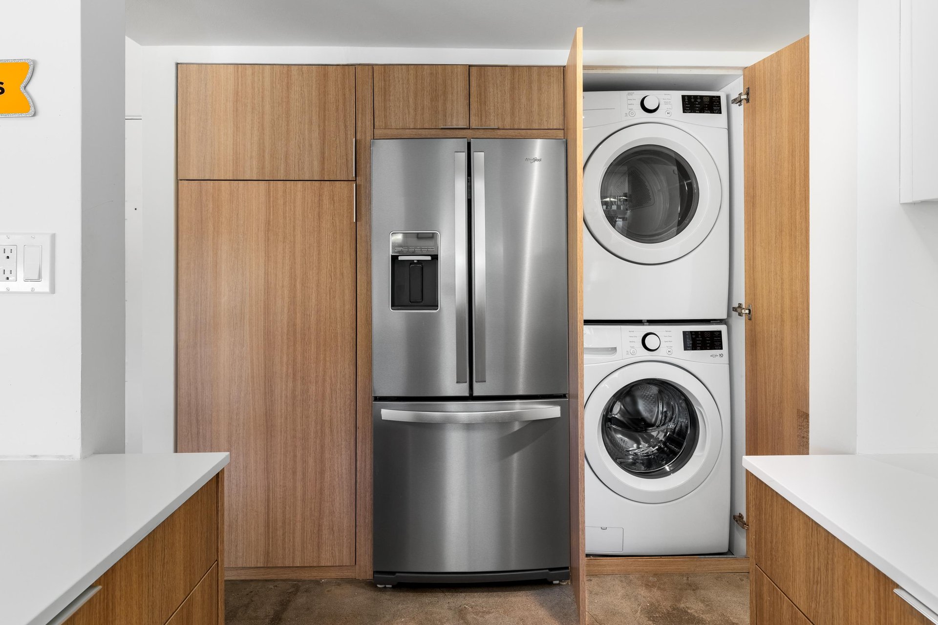 Your modern kitchen features stainless steel appliances and a convenient laundry closet with washer and dryer for effortless stays.