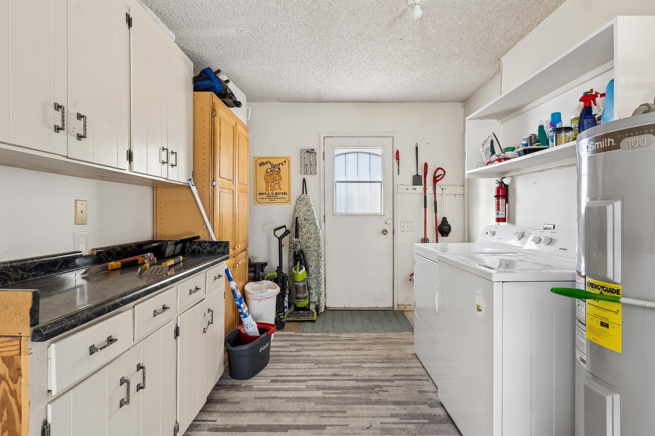 Washer, dryer, and cleaning supplies for guest use.