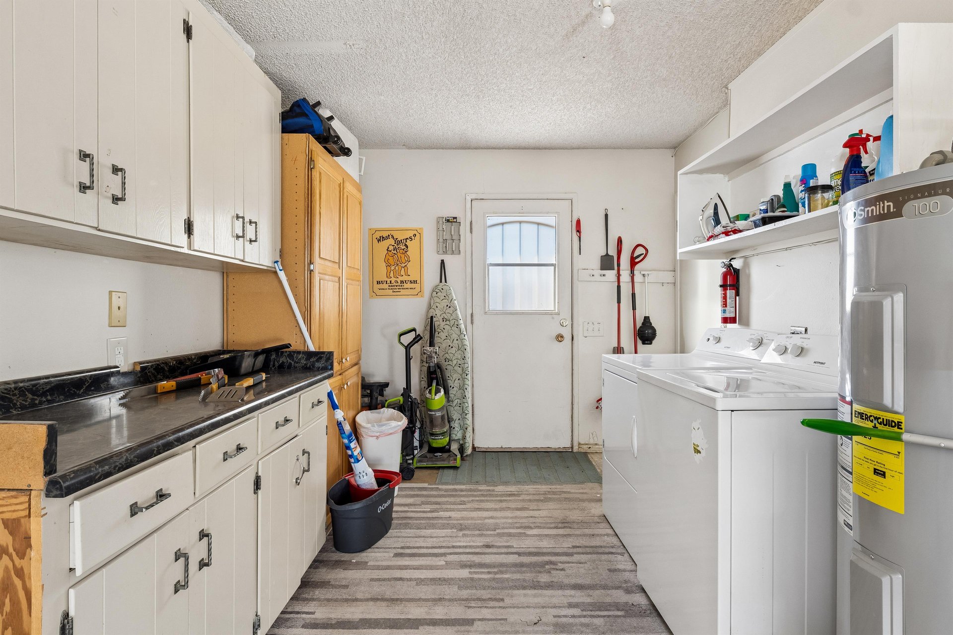 Washer, dryer, and cleaning supplies for guest use.