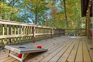 Cornhole game on deck