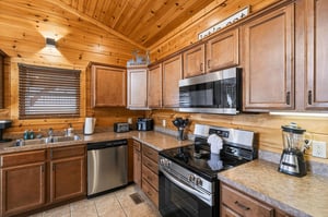 Craft memorable meals in your cozy cabin kitchen, complete with modern appliances and rustic charm.