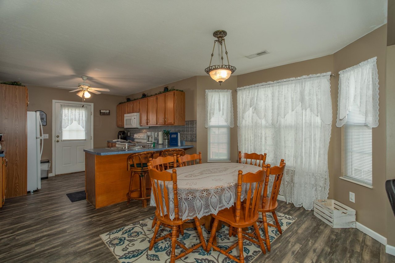 Dining table for six at Peace at the River, a 3 bedroom cabin rental located in Pigeon Forge