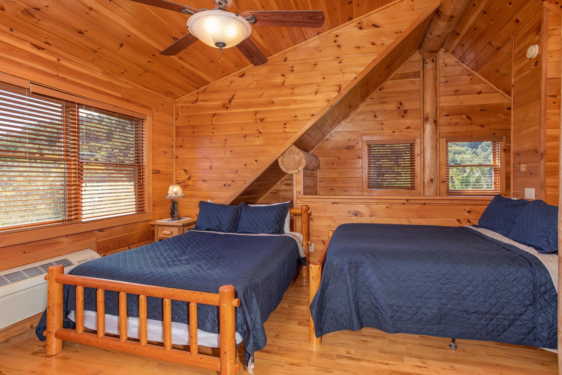 Room with three queen beds and two twin beds at Great View Lodge, a 5bedroom cabin rental located in Pigeon Forge