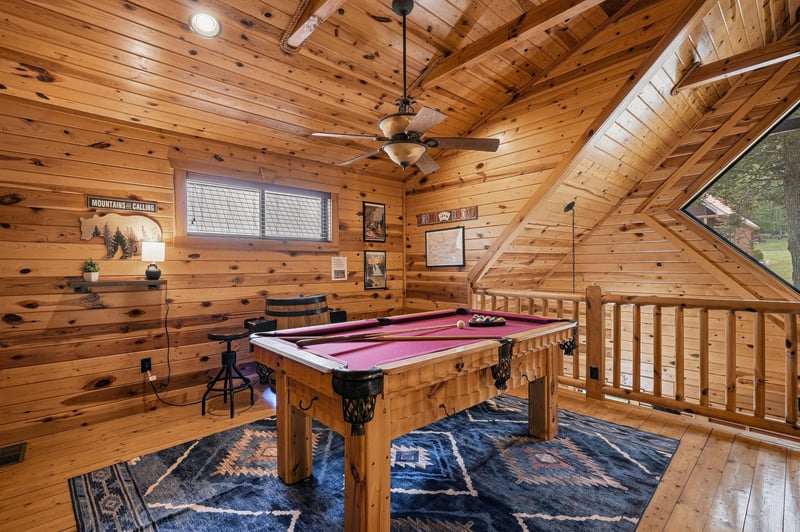 Challenge friends to pool while enjoying rustic charm in your private game loft with soaring woodbeam ceilings.