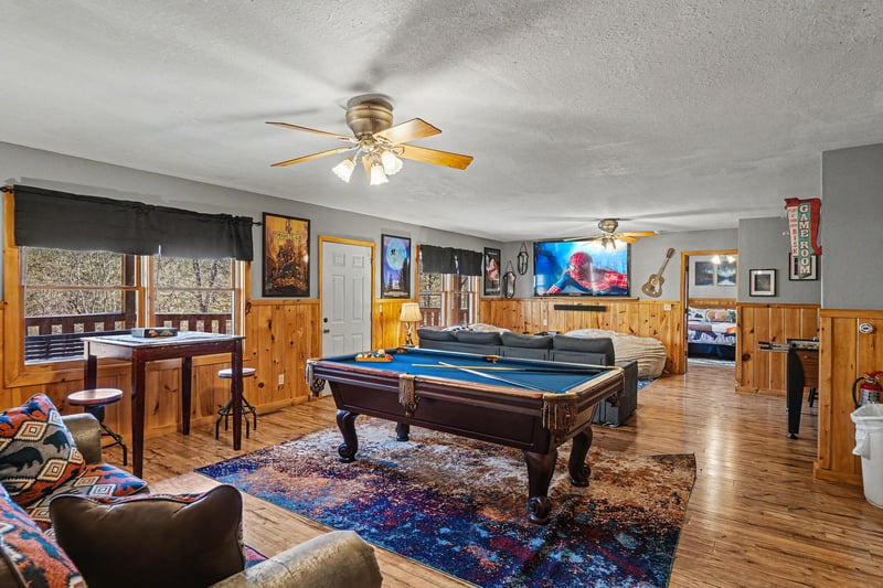 Your ultimate game room awaits with pool table, foosball, and cozy seating  perfect for friendly competition and relaxation.