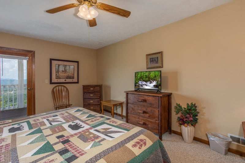 First bedroom with dressers and a television at Black Bear Ridge, a 3bedroom cabin rental located in Pigeon Forge