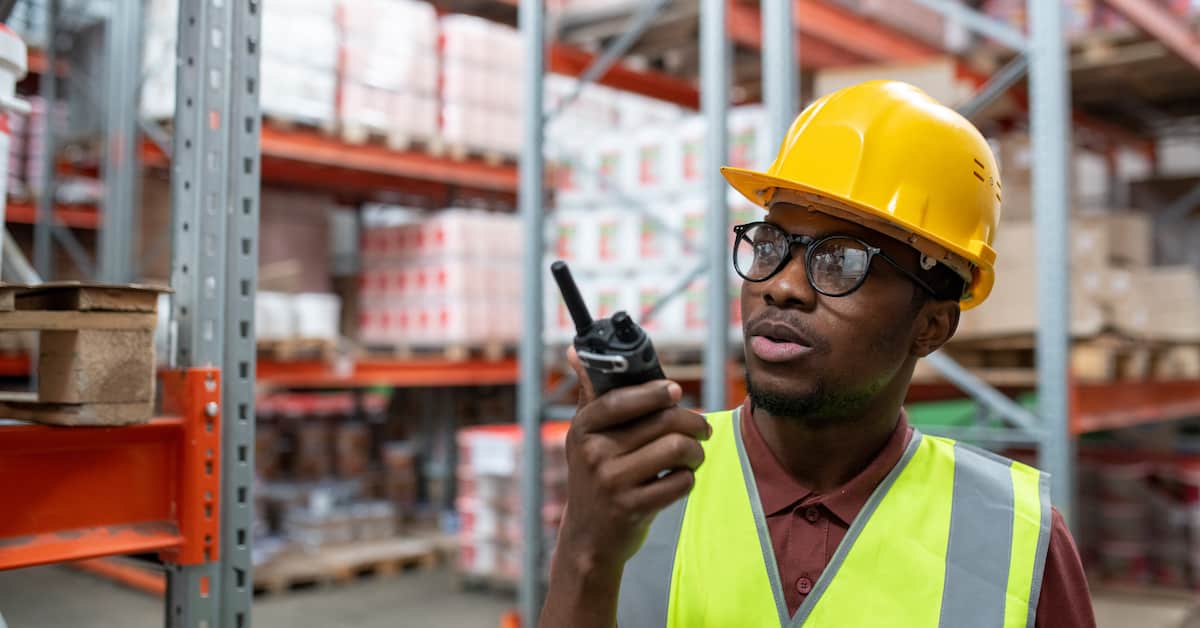 African American storeroom manager with radio