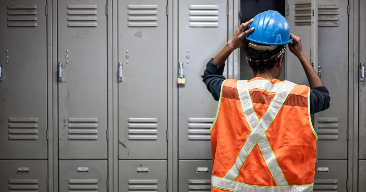 Factory worker wearing a safety vest getting ready