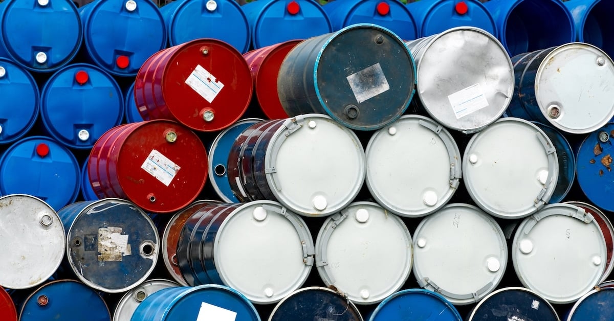 Stack of old chemical barrels - blue, black and red