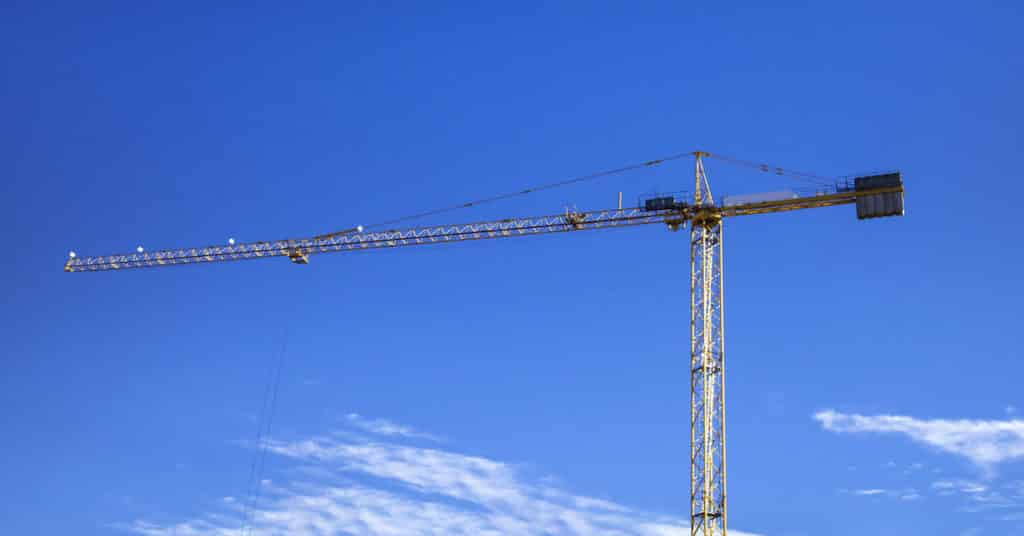 Construction crane against blue sky