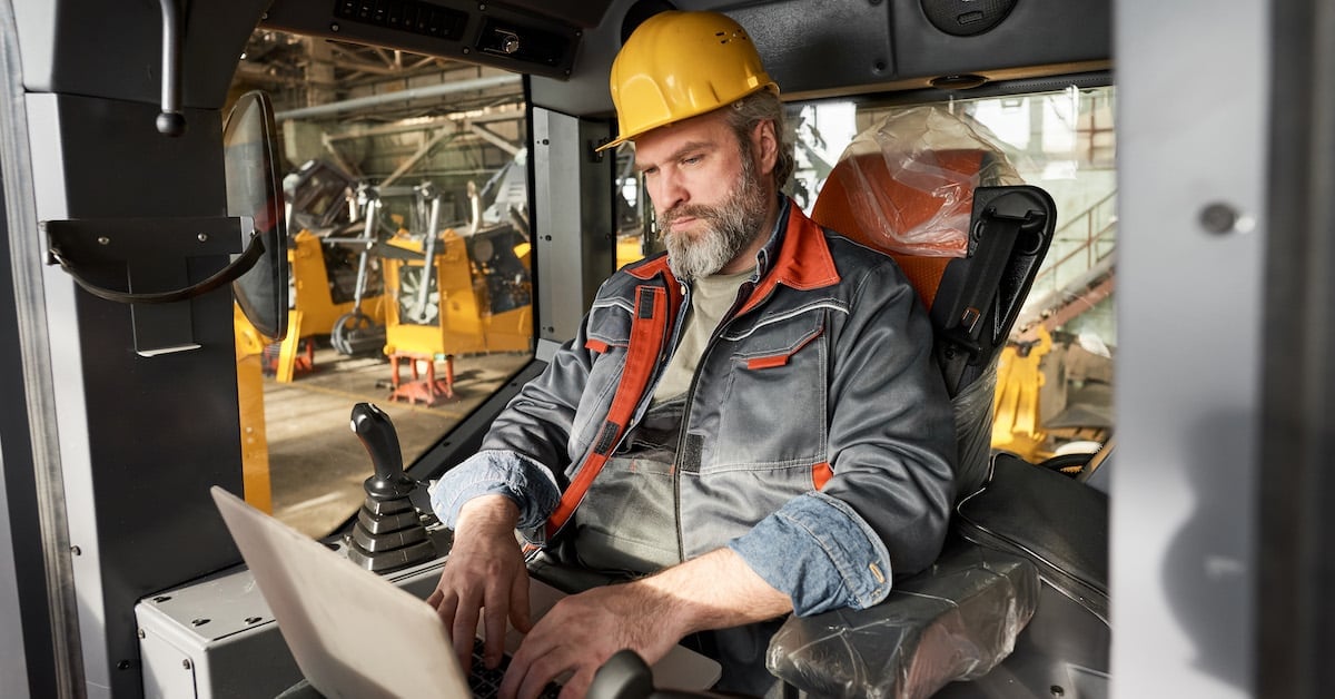 Operator controlling machine with laptop