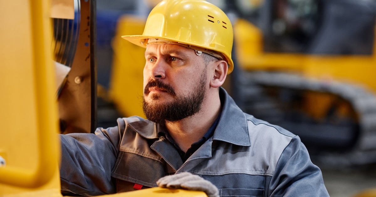 Serious foreman or repairman in boilersuit