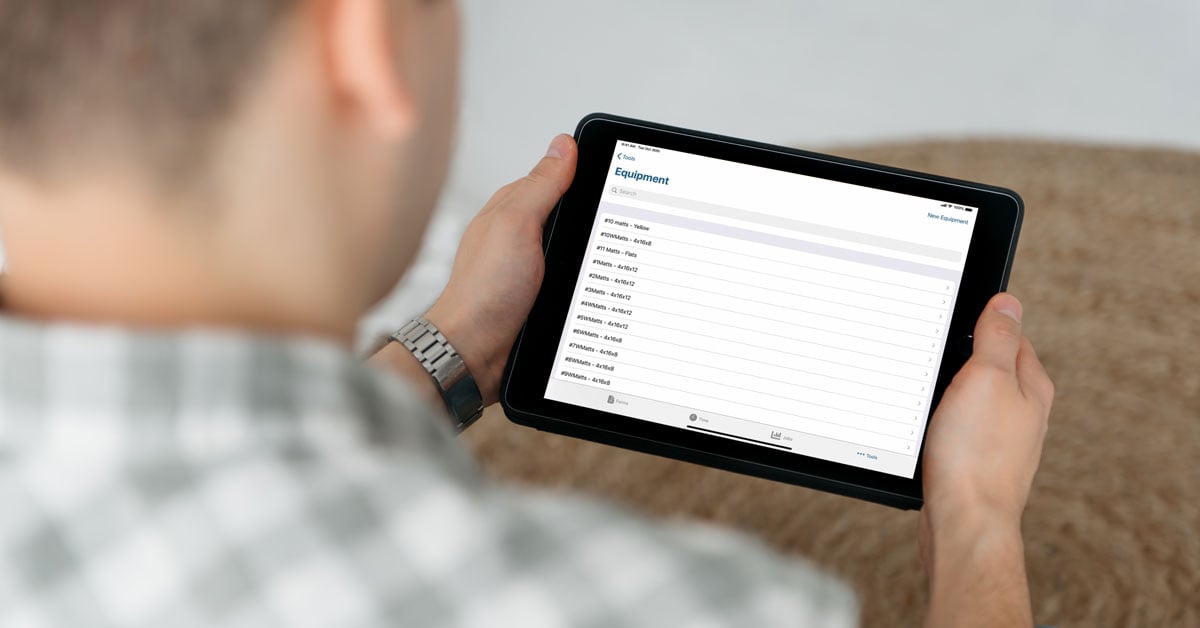 Person holding iPad - preventive maintenance technology