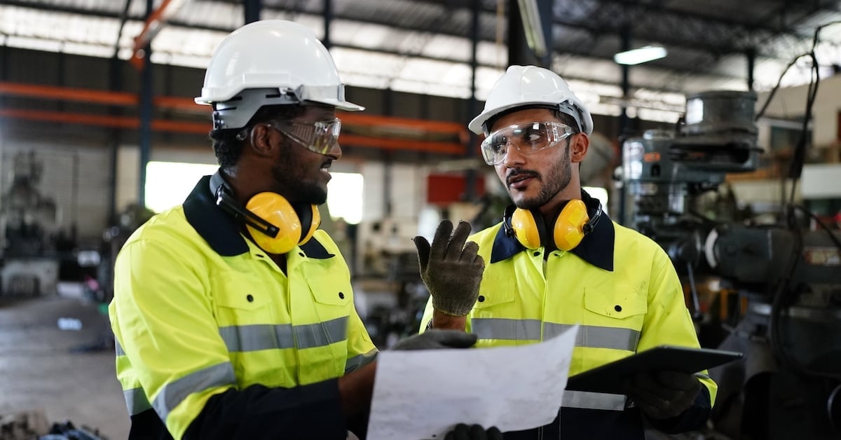 Industrial factory worker working in metal manufacturing facility