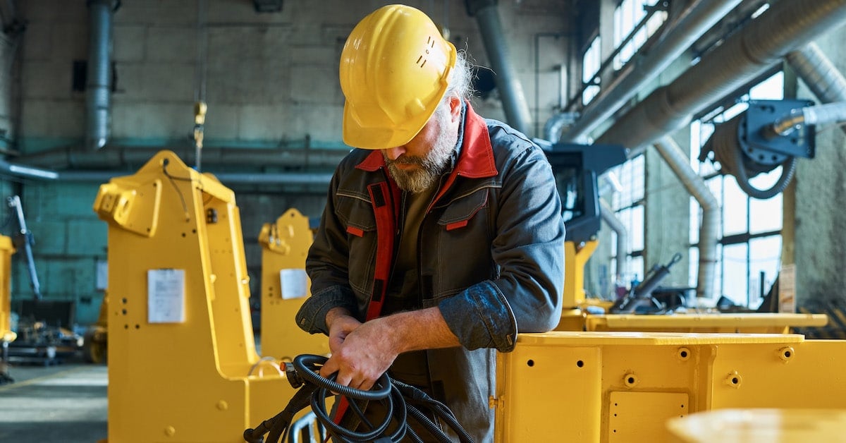 Man working with new equipment at factory