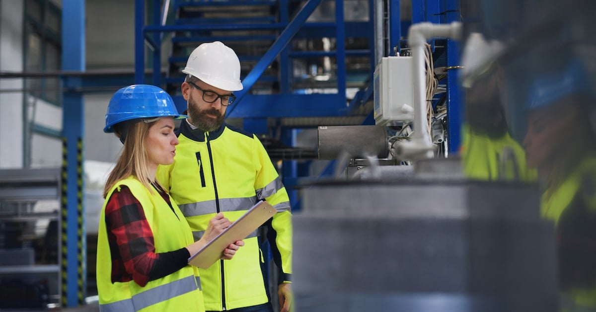 Engineering manager and mechanic worker doing routine maintenance