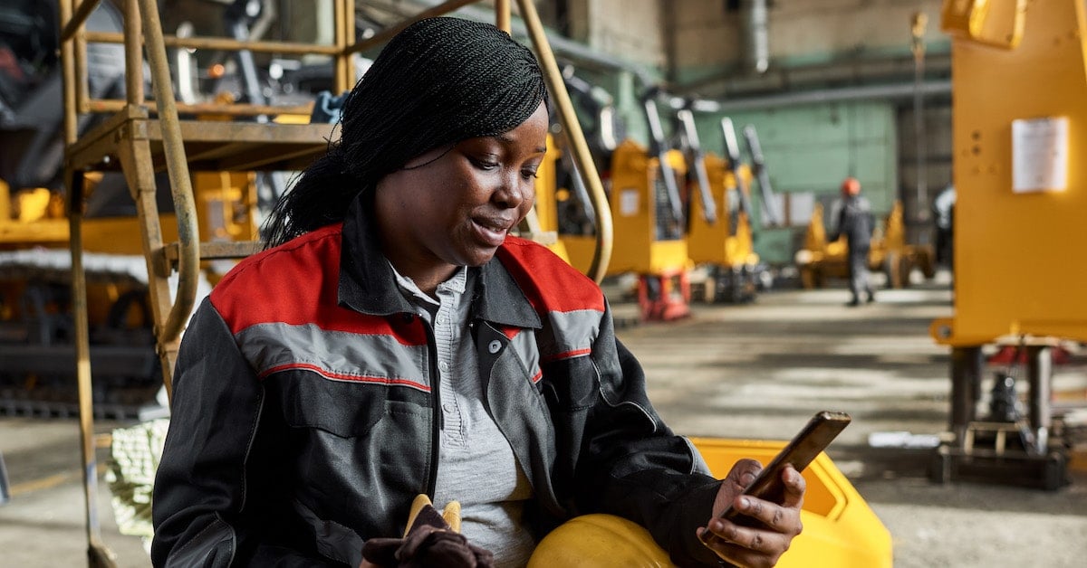 Worker using mobile phone during her break