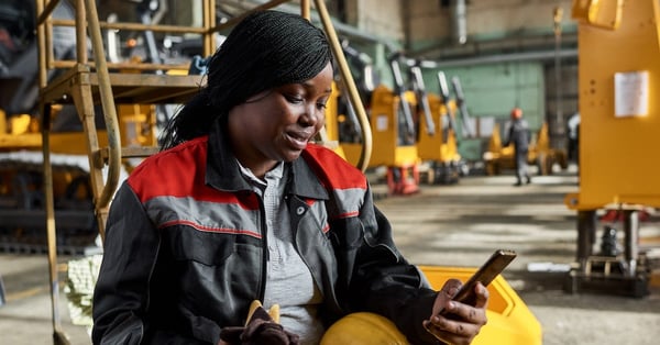 Worker using mobile phone during her break
