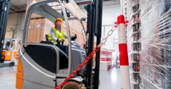 Safety at work with forklift in warehouse