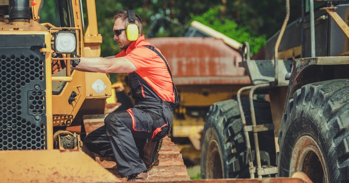 Broken bulldozer representing equipment maintenance cost management