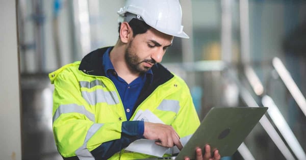 Engineering worker performing lubrication management