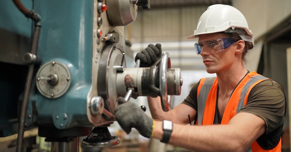 Maintenance engineers working in front of equipment