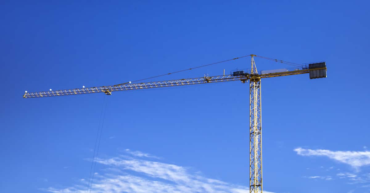 Construction crane against blue sky