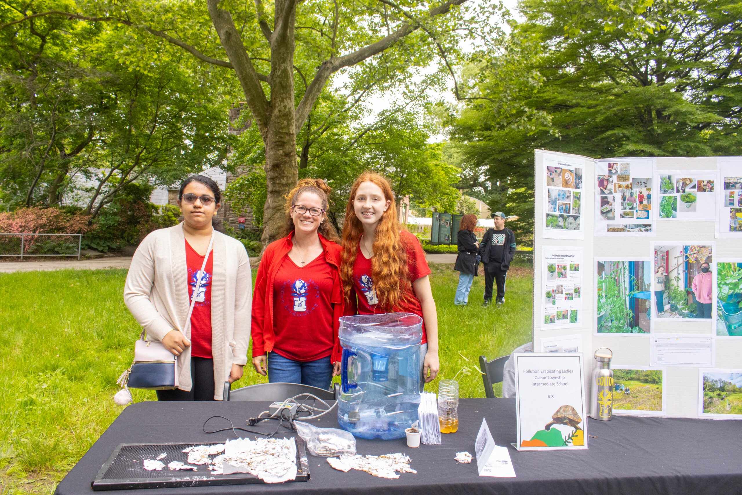The Pollution Eradicating Ladies from Ocean Township Intermediate pose with their final UNLESS Contest project.