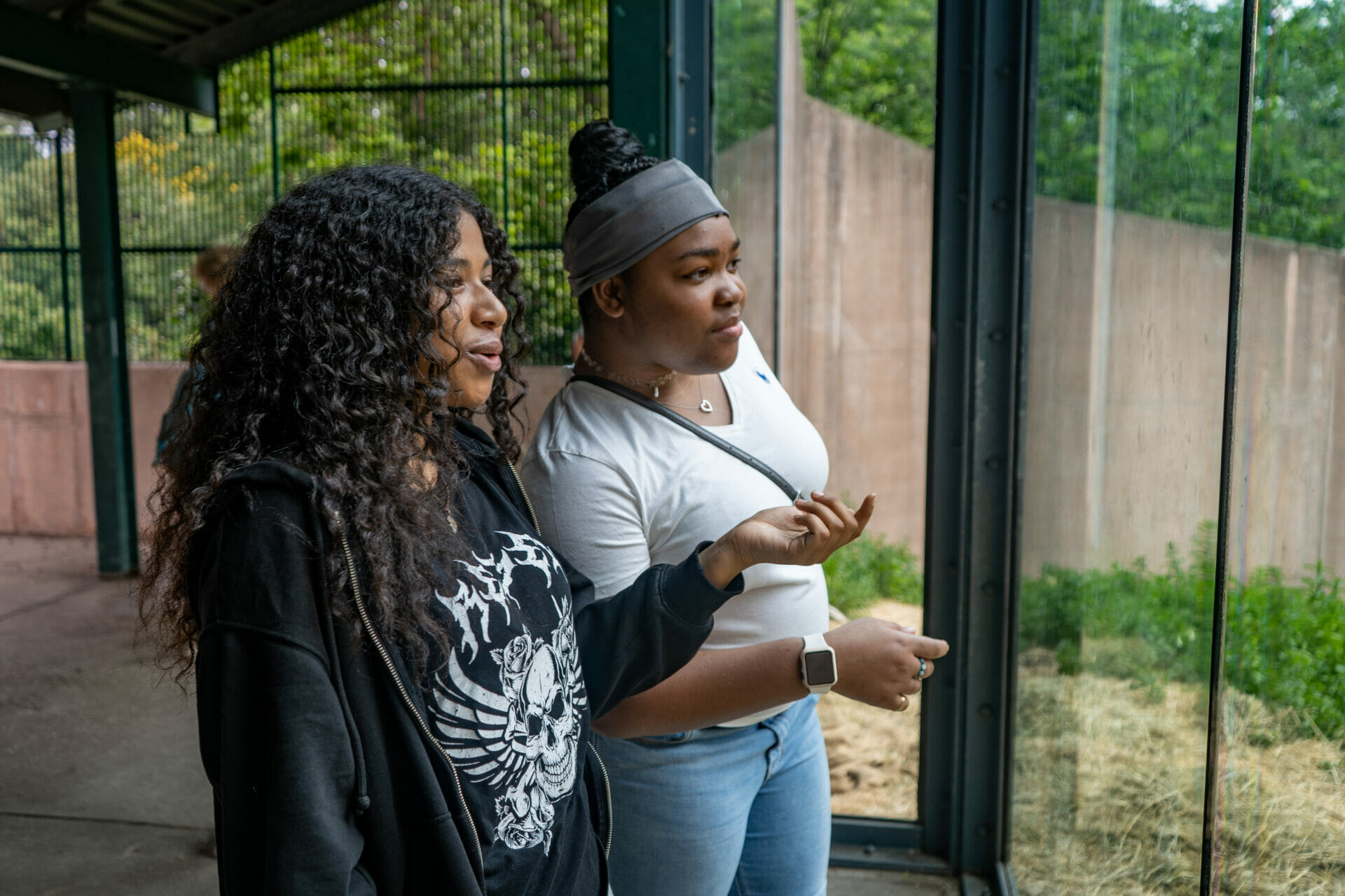 Two students make observations outside the gorilla enclosure at PECO Primate Reserve at Philadelphia Zoo as part of the West Philadelphia Zoo Scholars program.