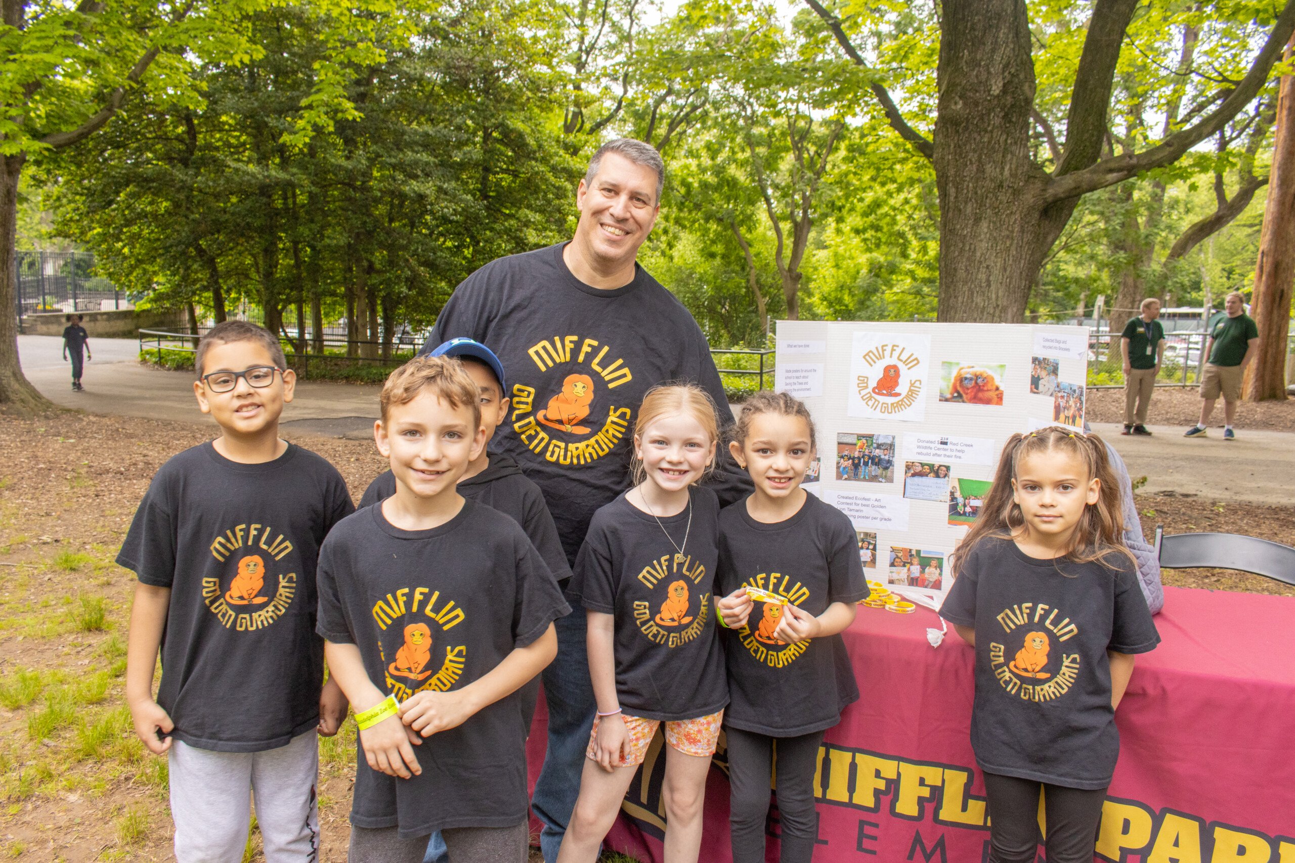 The Mifflin Park Golden Guardians pose with their final UNLESS Contest project.